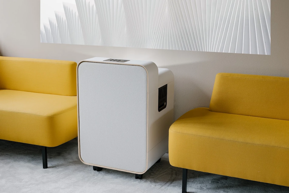 Artome mobile installation-free AV unit between yellow sofas