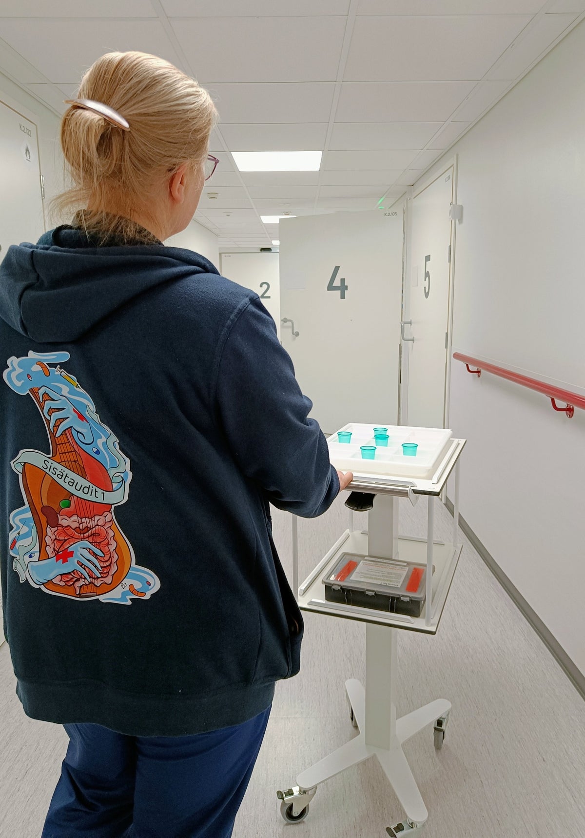 HOSPI S medical trolley being moved along hospital corridor